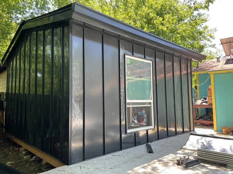Black standing seam metal wall panels for Roof Inspection in Cumming